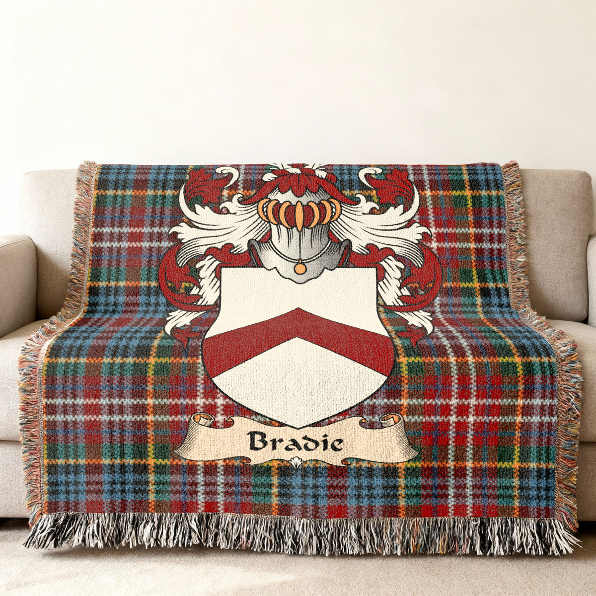 Bradie Scottish woven blanket with family shield and Caledonia tartan background