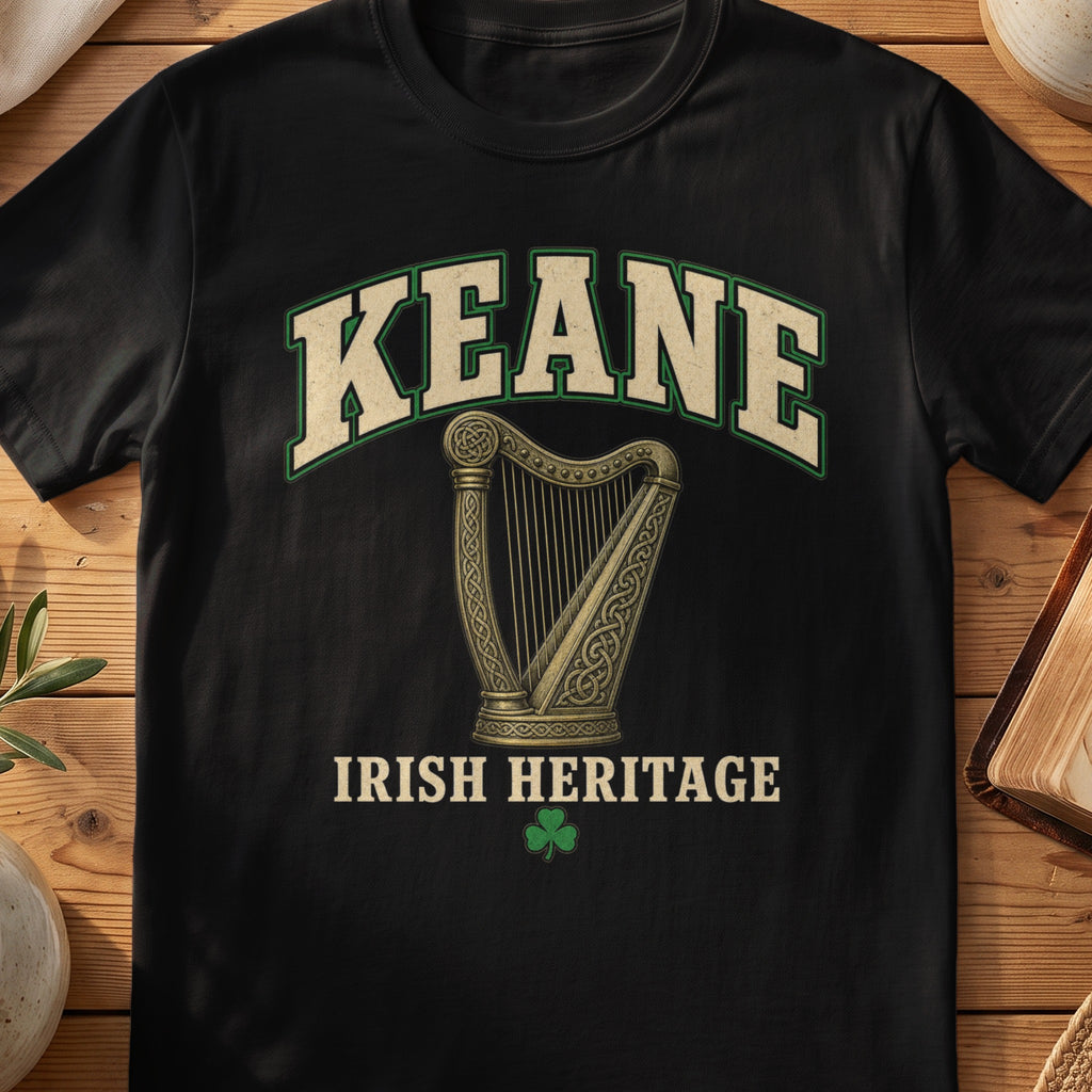 Keane Irish harp T-shirt in Black, with cream surname lettering, a gold-toned harp, green shamrock and “Irish Heritage” text.