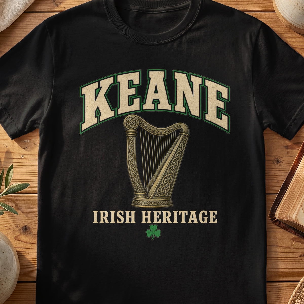 Keane Irish harp T-shirt in Black, with cream surname lettering, a gold-toned harp, green shamrock and “Irish Heritage” text.