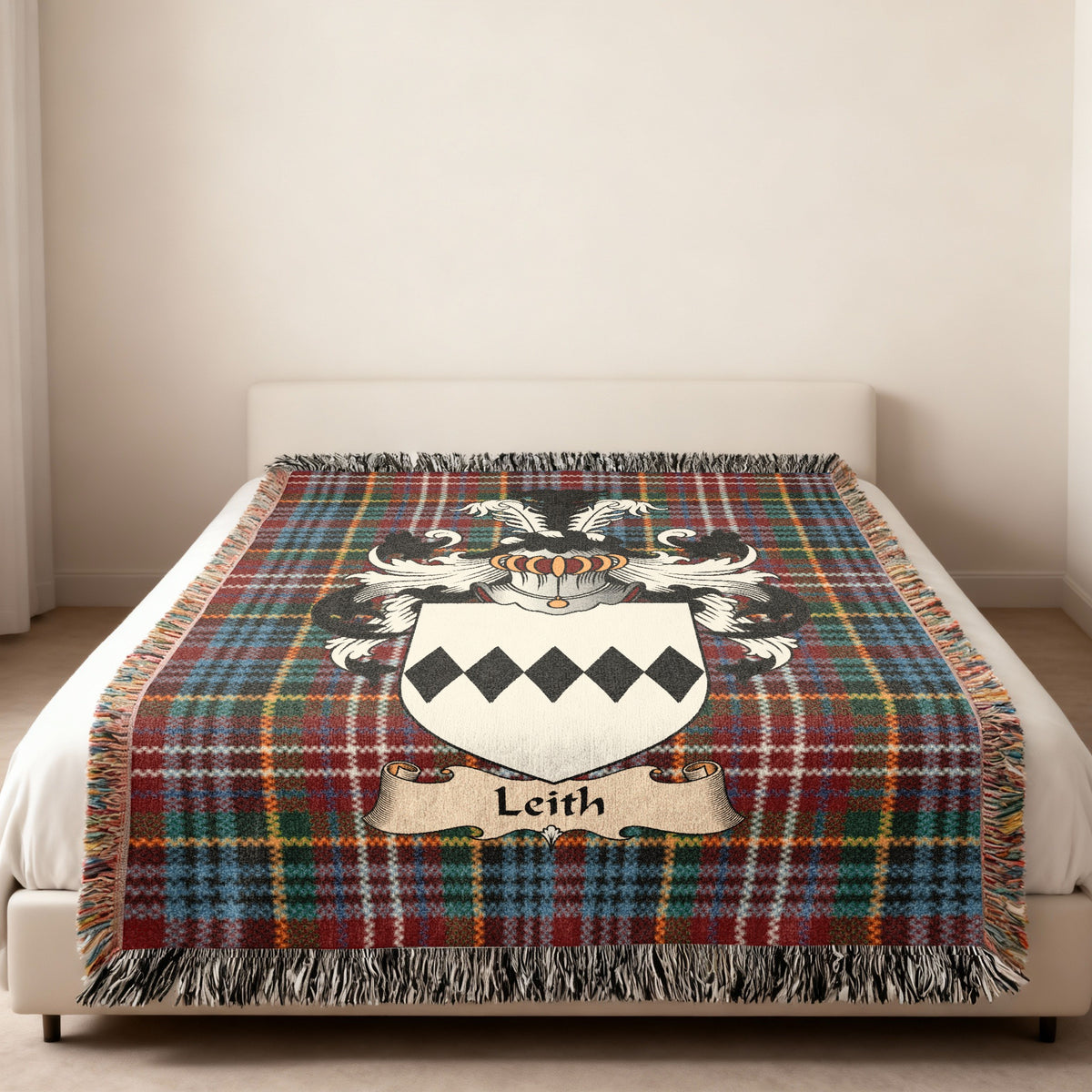 Leith Scottish family shield woven blanket on a Caledonia tartan background