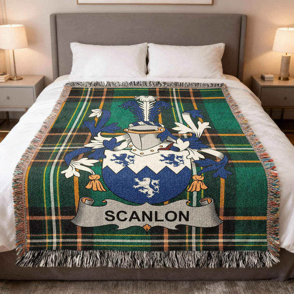 Scanlon family crest on a tartan plaid blanket on a bed.