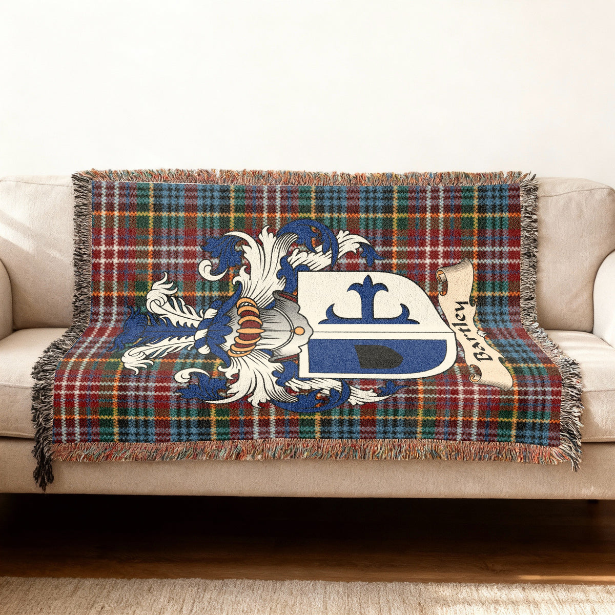 Features of the Bartley Scottish family shield woven blanket with Caledonia tartan background