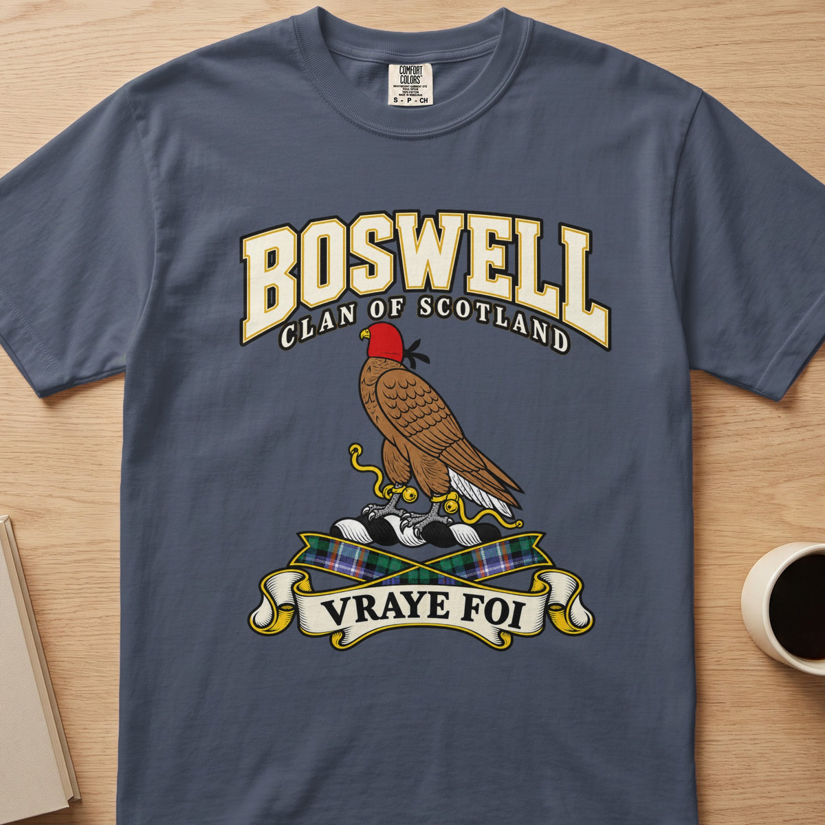 Boswell clan crest with hooded brown bird on a slate blue Comfort Colors T-shirt, front view