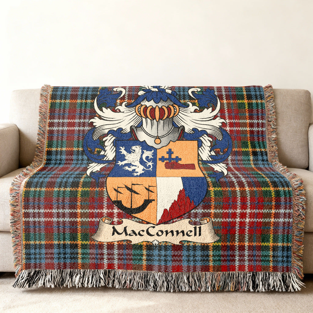 MacConnell family crest emblem on a Caledonia tartan woven blanket