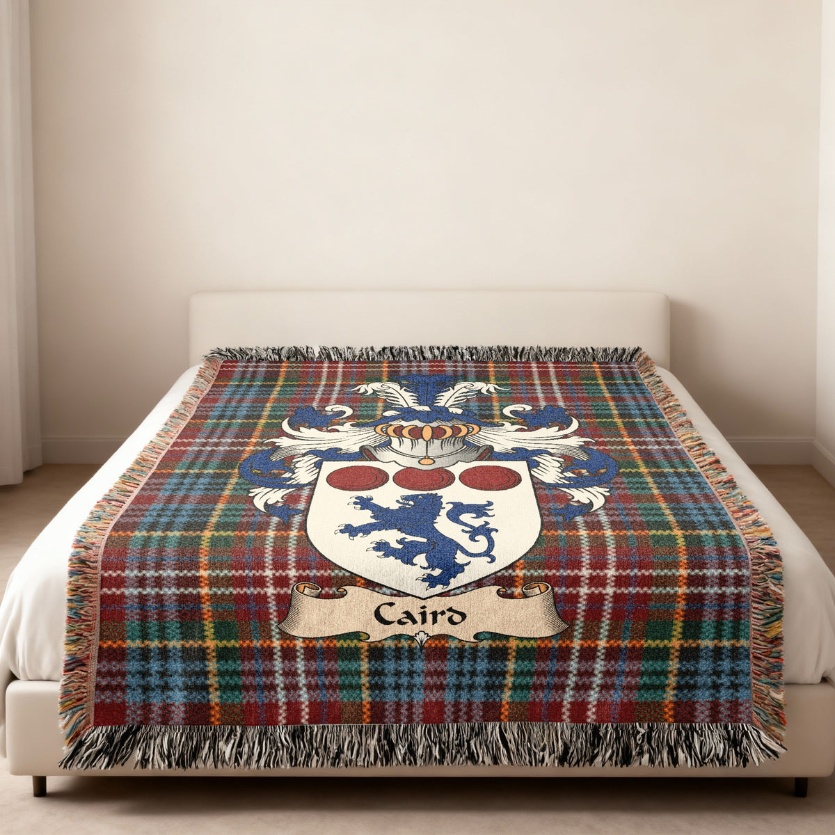 Caird Scottish family shield woven blanket on a Caledonia tartan background