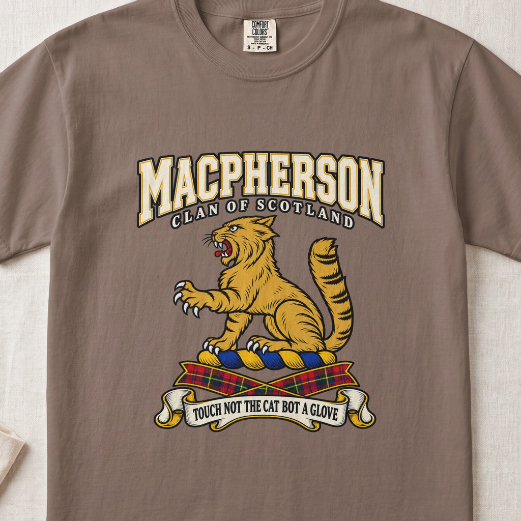 MacPherson graphic T-shirt in Espresso brown, front flat lay showing varsity lettering and seated gold wildcat with black stripes, raised paw and upright tail.