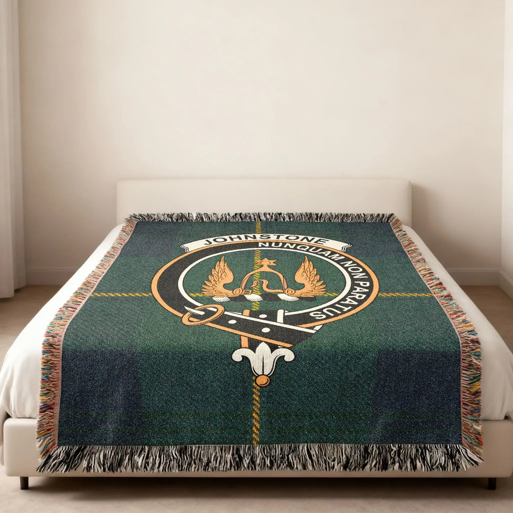 Johnstone Nunquam Non Paratus crest woven blanket — heraldic design at centre, fringe edge visible