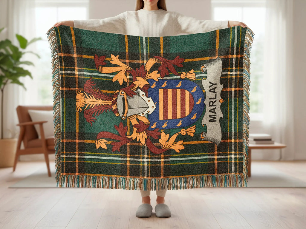 Green tartan blanket with a family crest and "MARLAY" text.