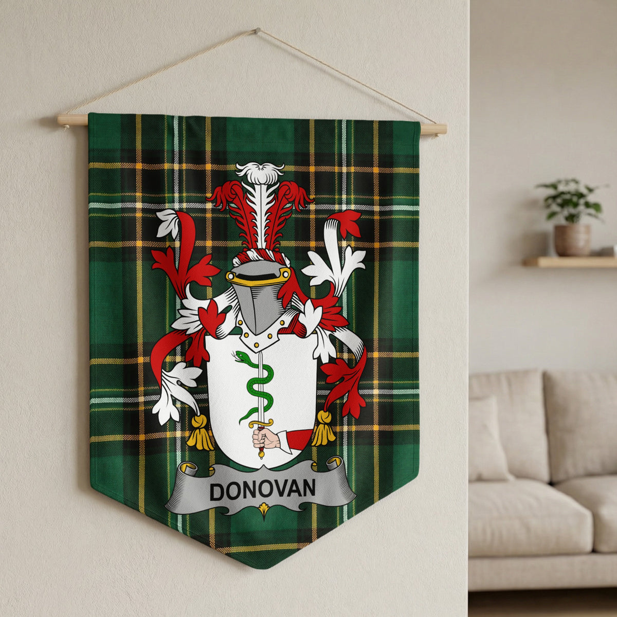 Donovan family crest on green tartan fabric banner hanging from wooden dowel.
