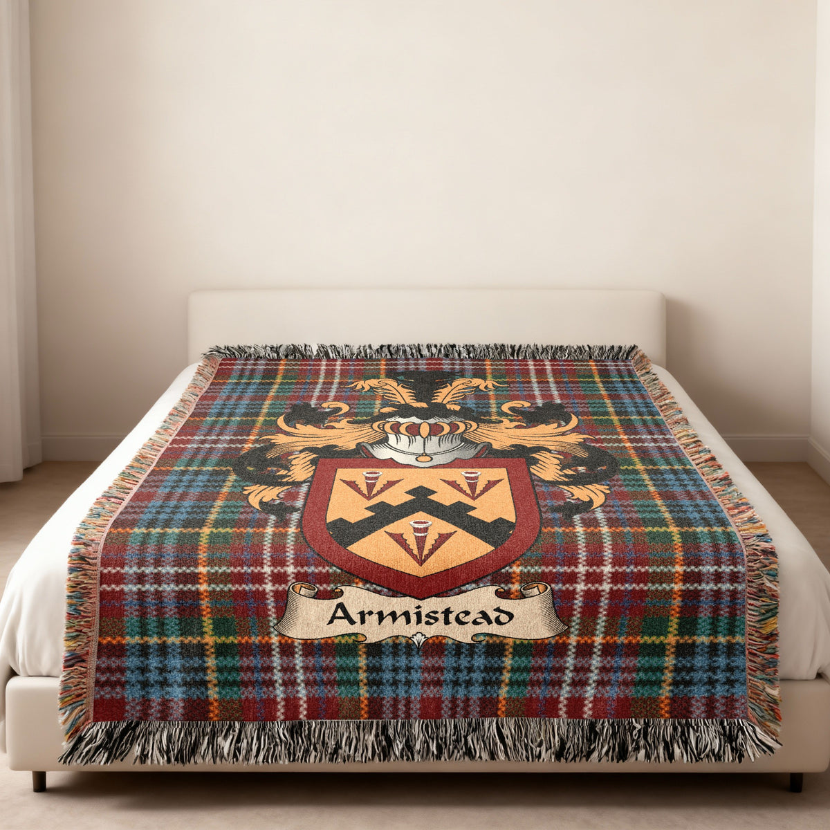 Armistead family crest emblem on a Caledonia tartan woven blanket