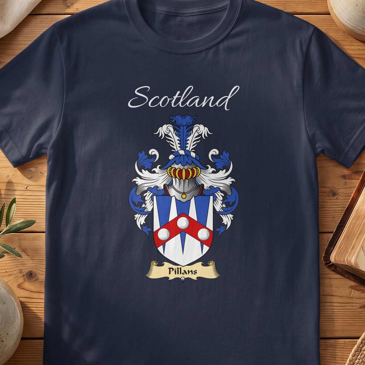Navy Pillans heritage T-shirt laid flat with “Scotland” and the colourful family shield design.