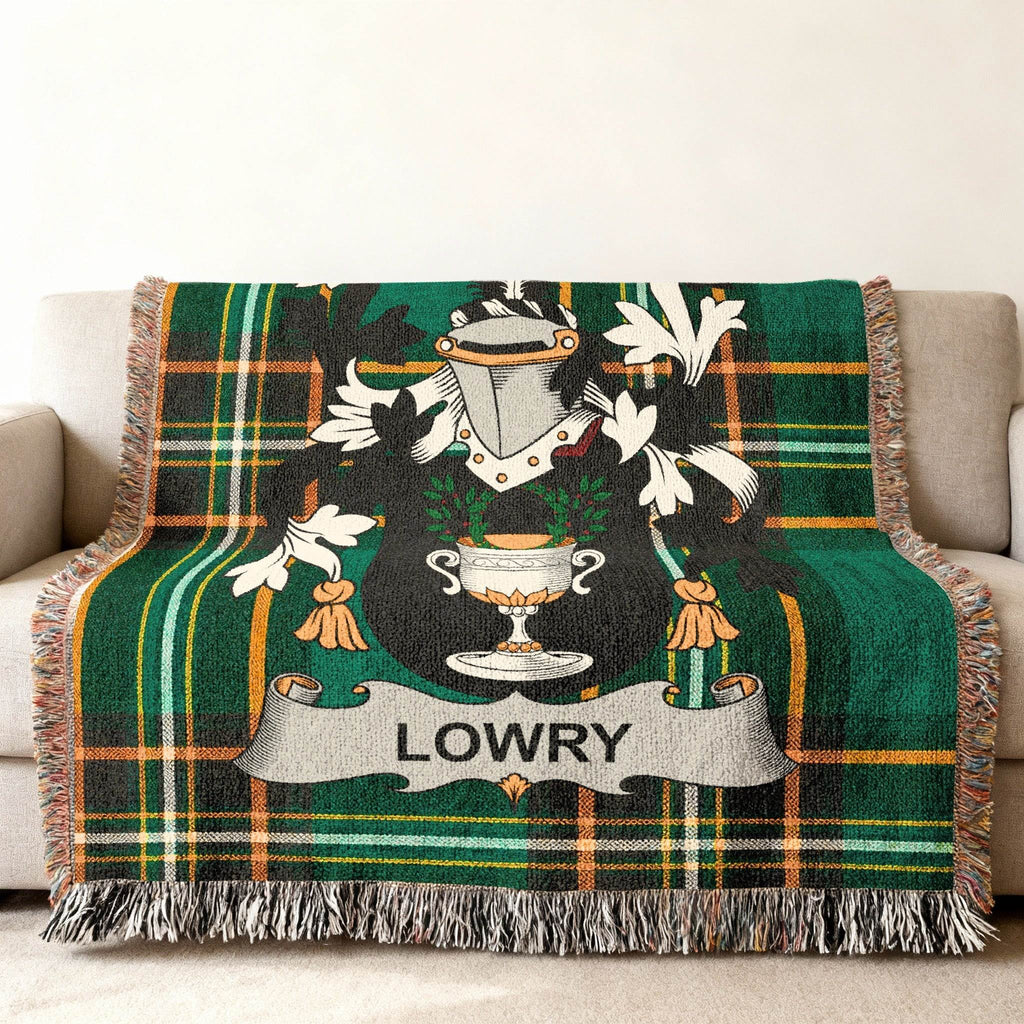 Green tartan throw blanket with the "LOWRY" family crest centered.