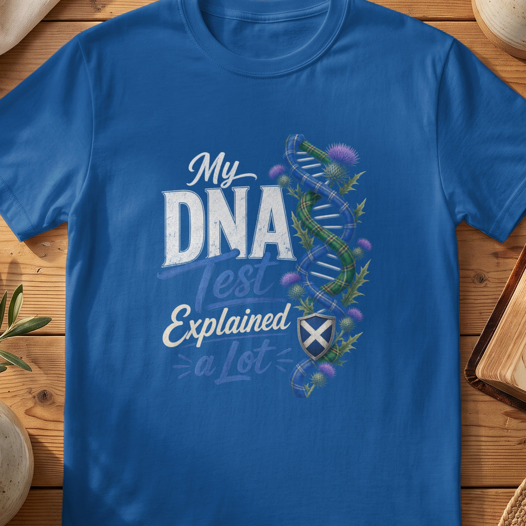 Blue t-shirt with "My DNA Test Explained a Lot" and Scottish thistle and plaid DNA.
