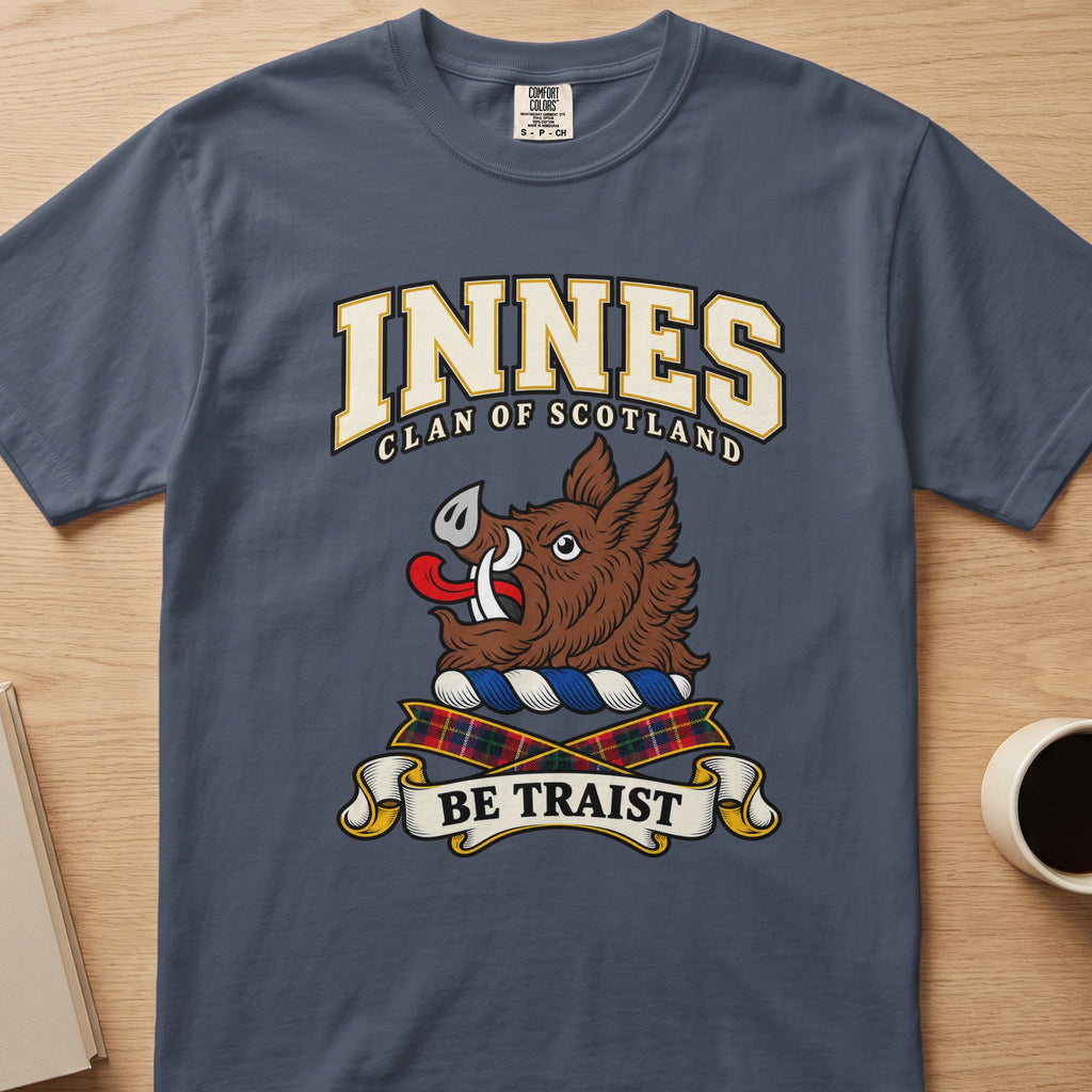 Innes clan crest with brown boar head on a slate blue Comfort Colors T-shirt, front view