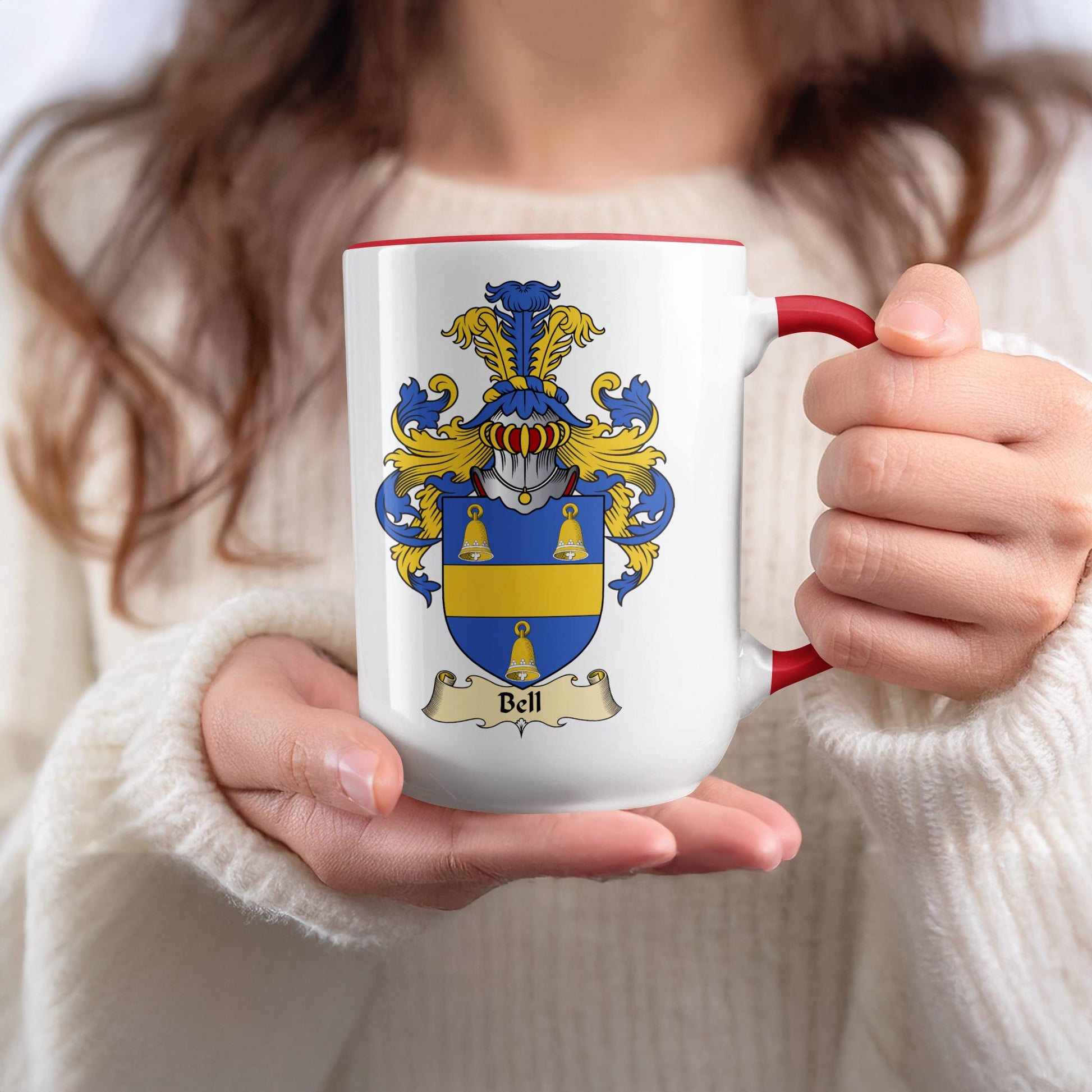 White mug with red rim featuring the Bell family crest.