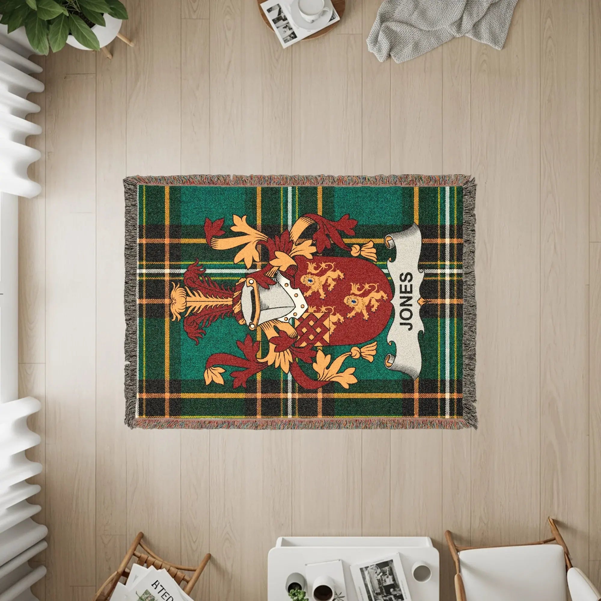 Tapestry throw blanket with the Jones family crest on a green plaid background.