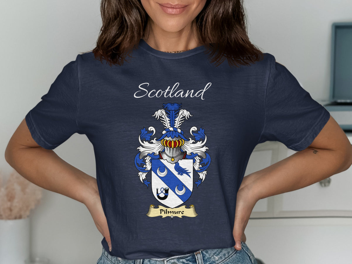 Model wearing the navy Pilmure family crest T-shirt featuring “Scotland” and the surname banner.