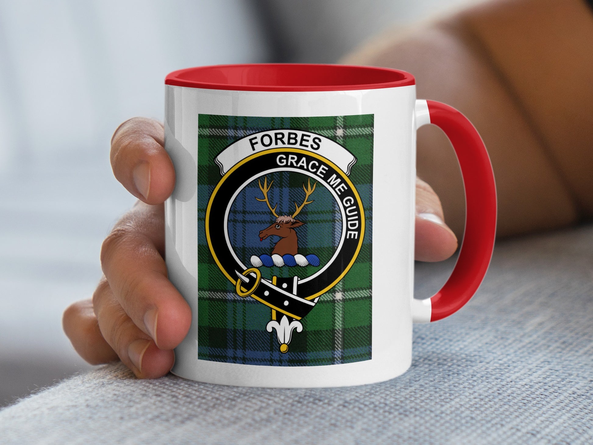 Forbes clan crest on a mug with red handle and rim.