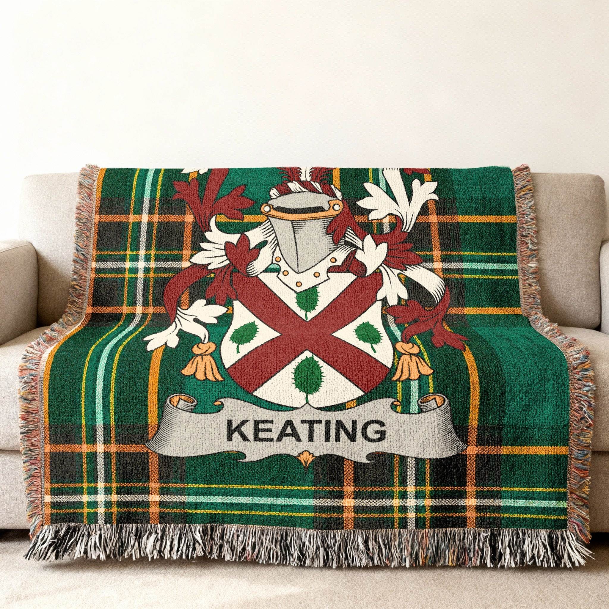 Keating family crest on a green tartan throw blanket draped over a sofa.