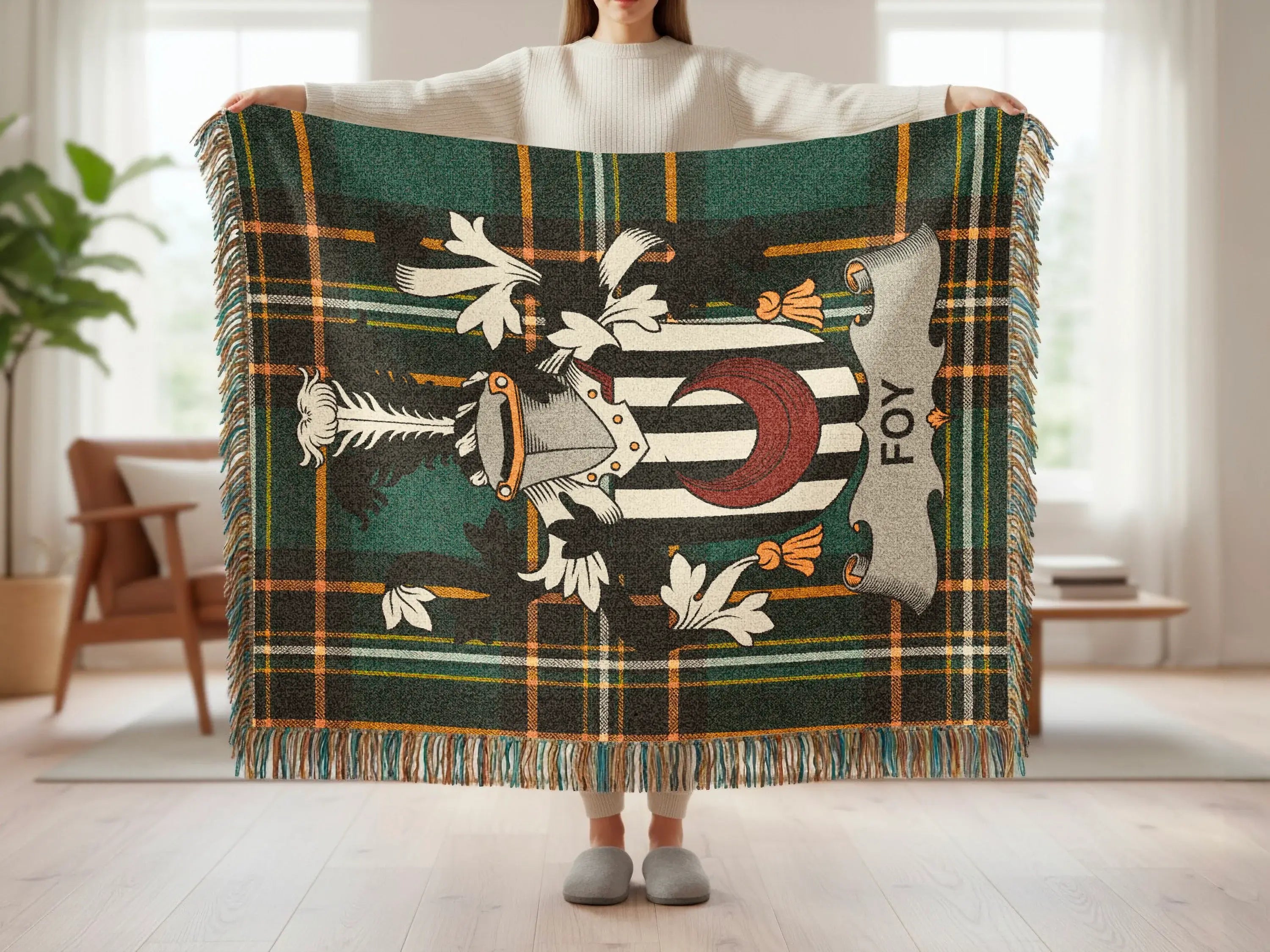 Plaid throw blanket with coat of arms featuring the name "FOY".