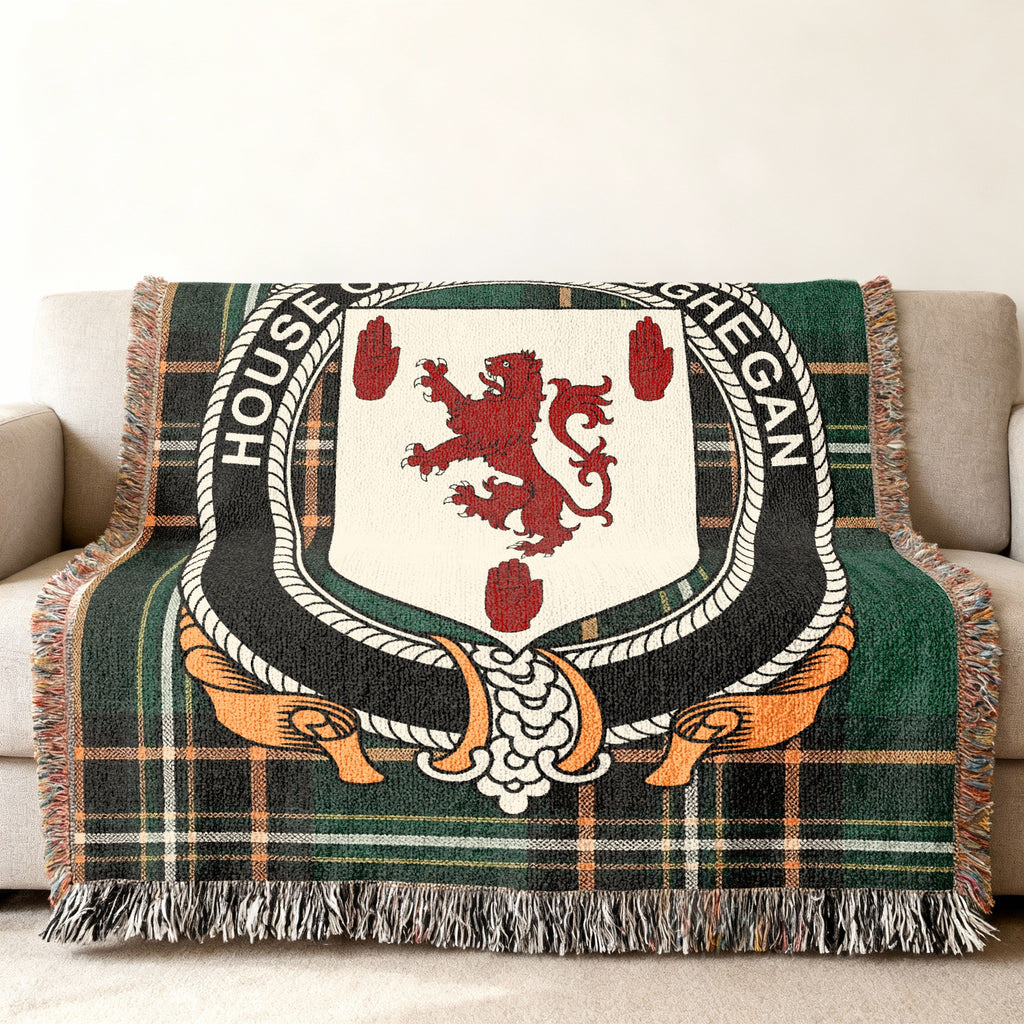 Maceoghegan Irish National Tartan woven blanket displayed on a sofa
