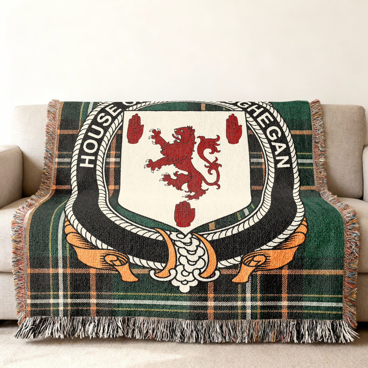 Maceoghegan Irish National Tartan woven blanket displayed on a sofa