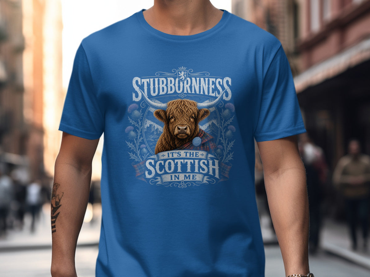Blue t-shirt with Scottish Highland bull graphic and text "Stubbornness, It's The Scottish In Me".