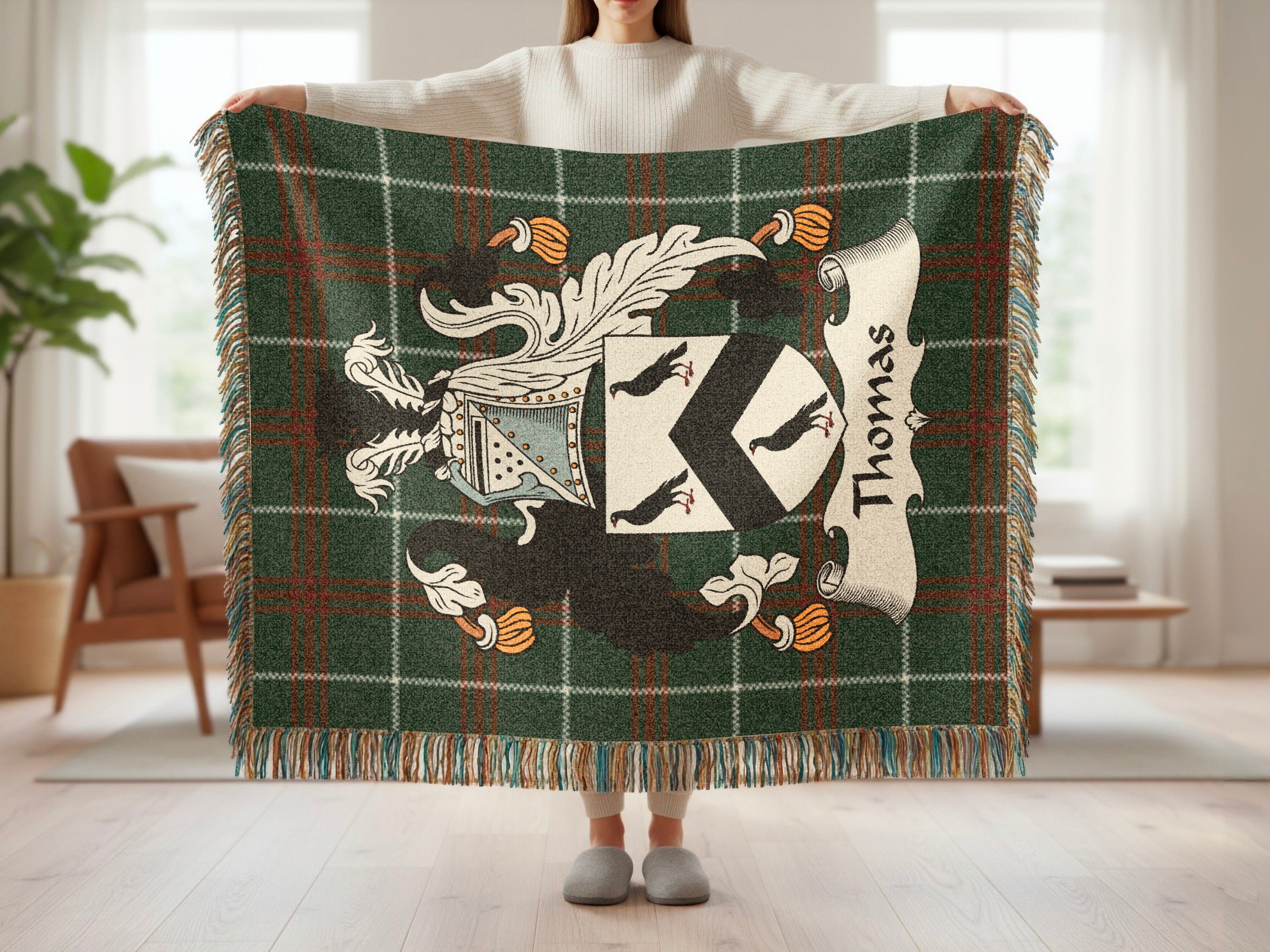 Green tartan blanket with Thomas family crest and surname.