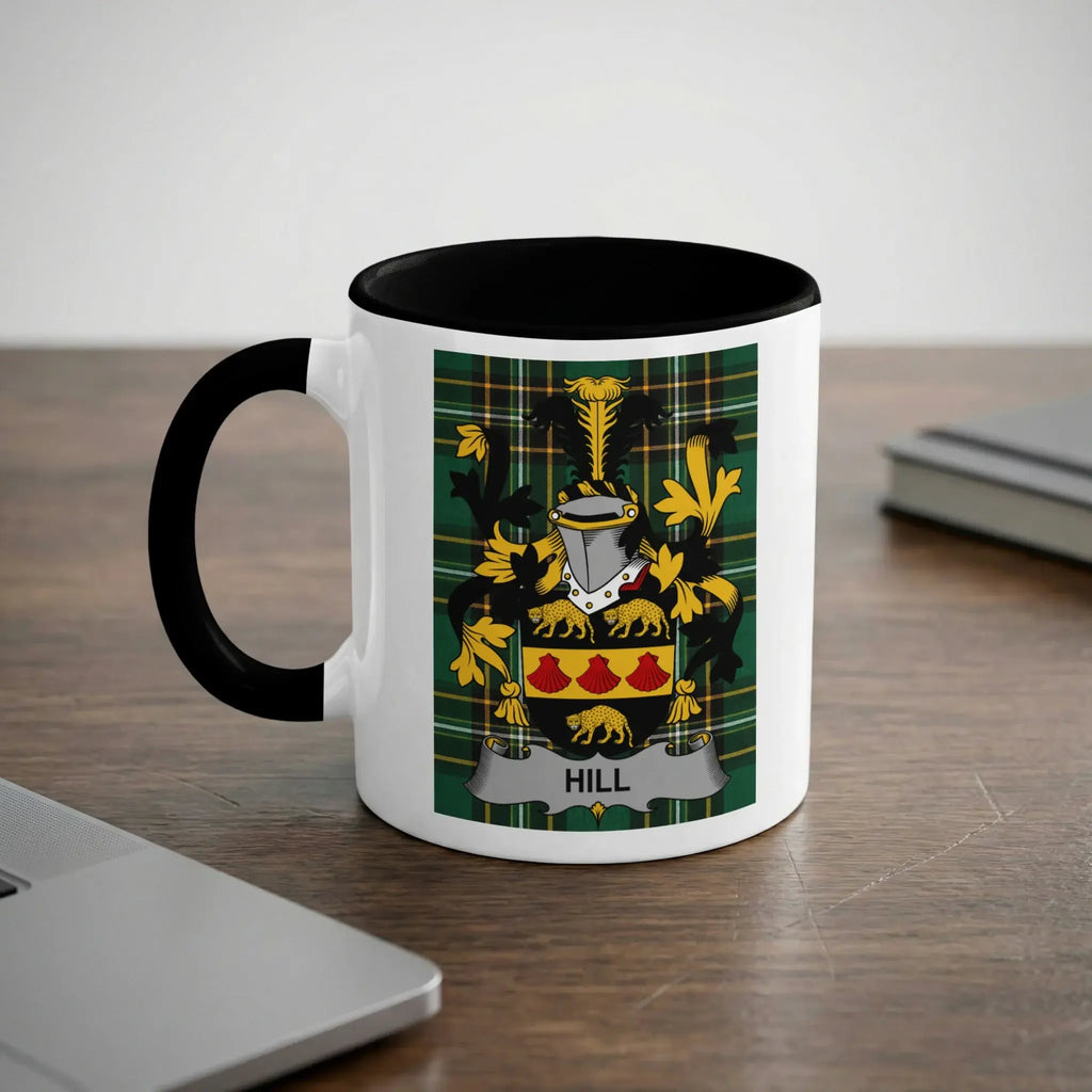 White mug with black rim and handle, featuring a green plaid crest with "HILL" text.
