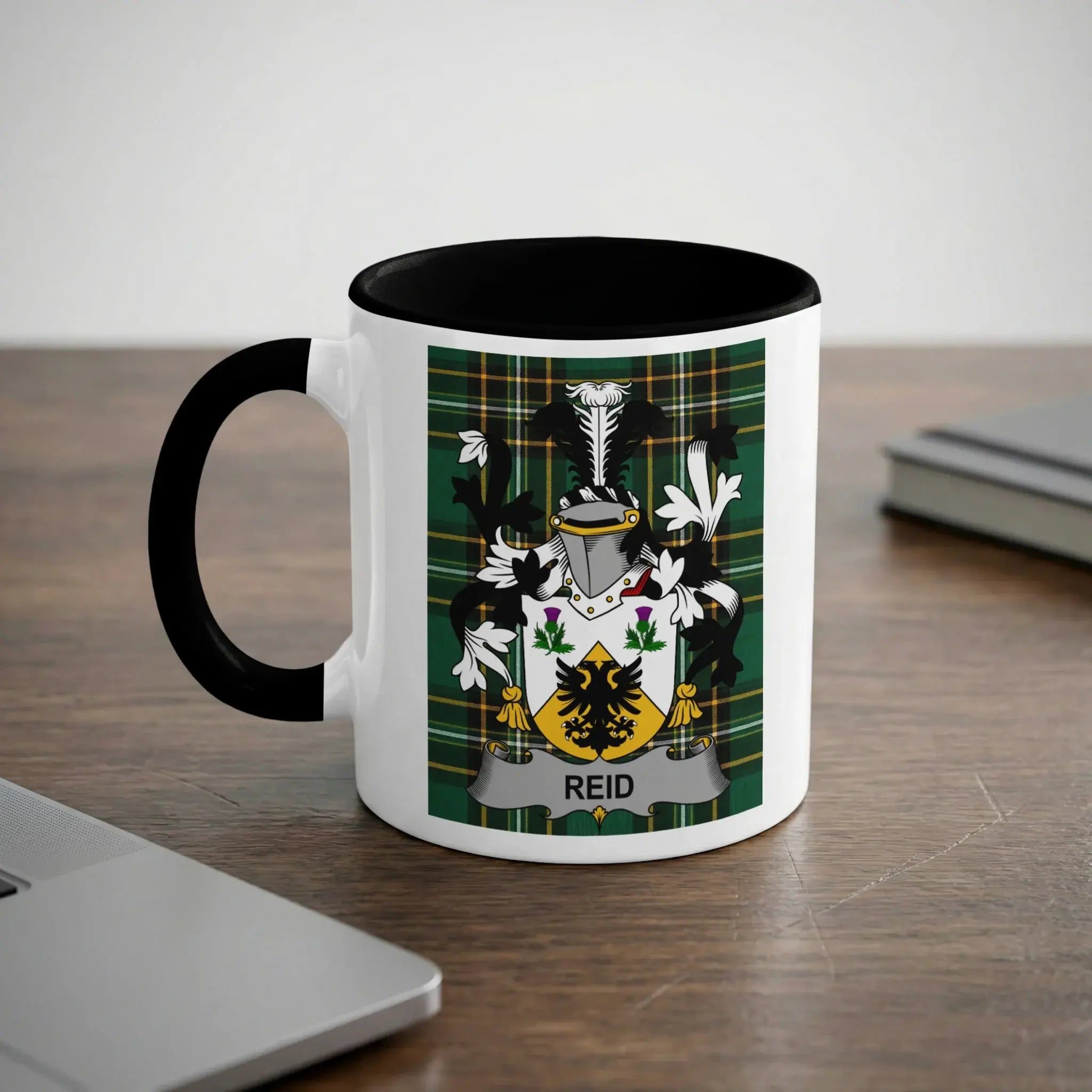 Reid family crest on green tartan plaid mug — 11 oz ceramic, black handle, Scottish clan