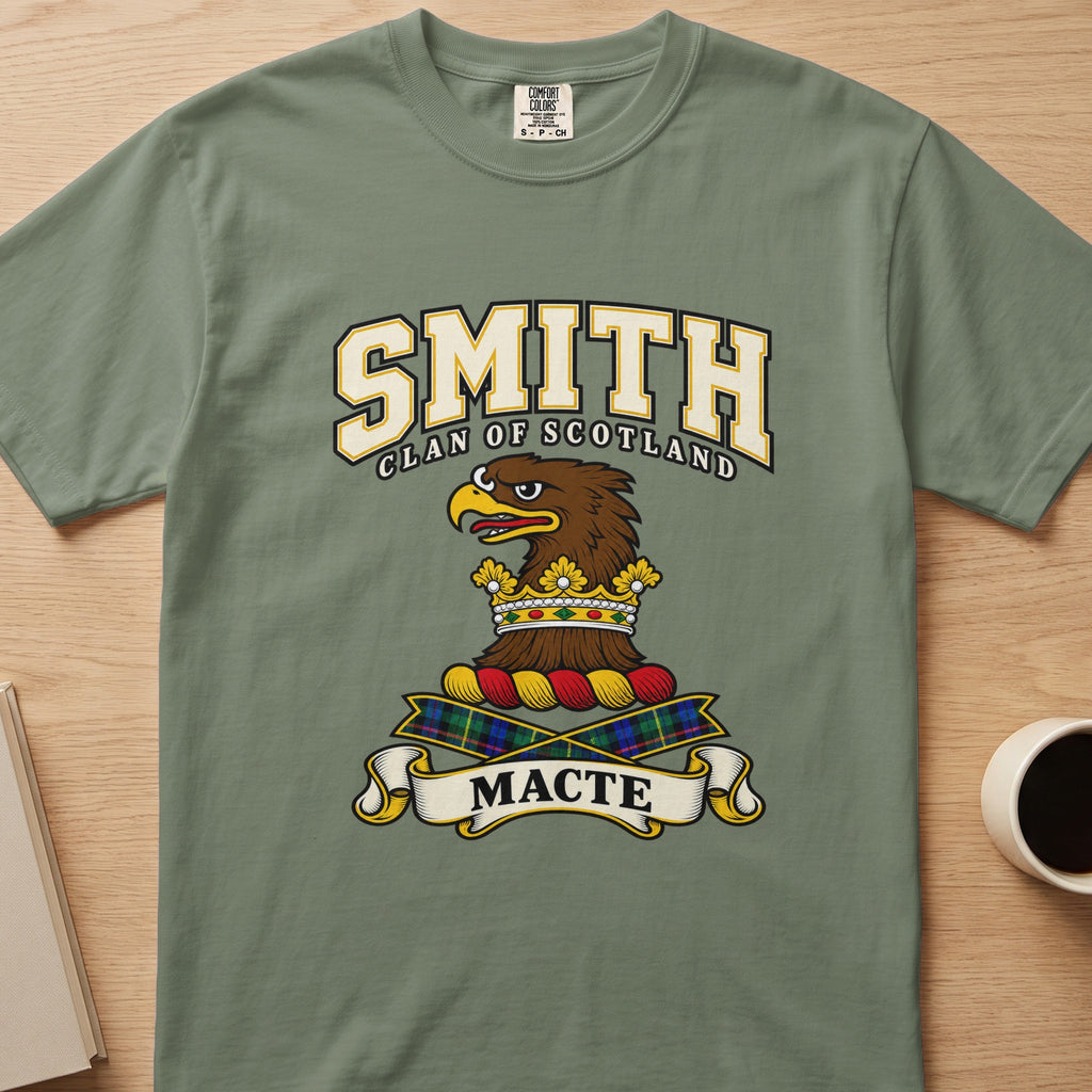 Smith brown eagle-head crest with gold accents graphic on a sage green Comfort Colors T-shirt, front view