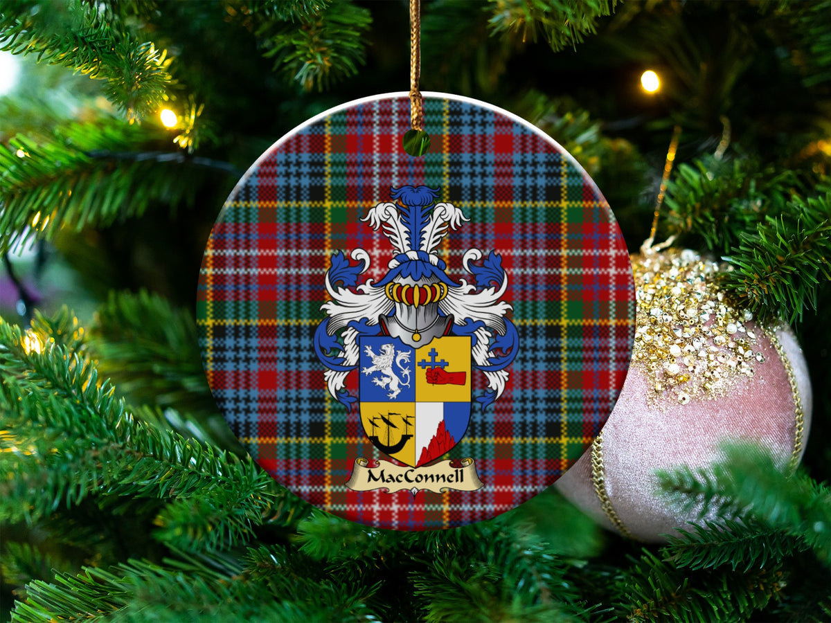 MacConnell Scottish clan ceramic ornament with family crest on a Caledonia tartan background, hanging on a Christmas tree