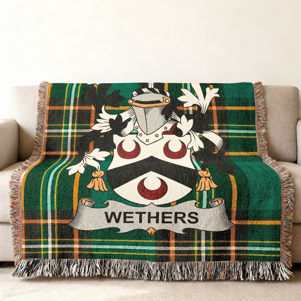 Wethers family crest on a green tartan throw blanket.