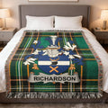 Richardson family crest on green plaid throw blanket on a bed.