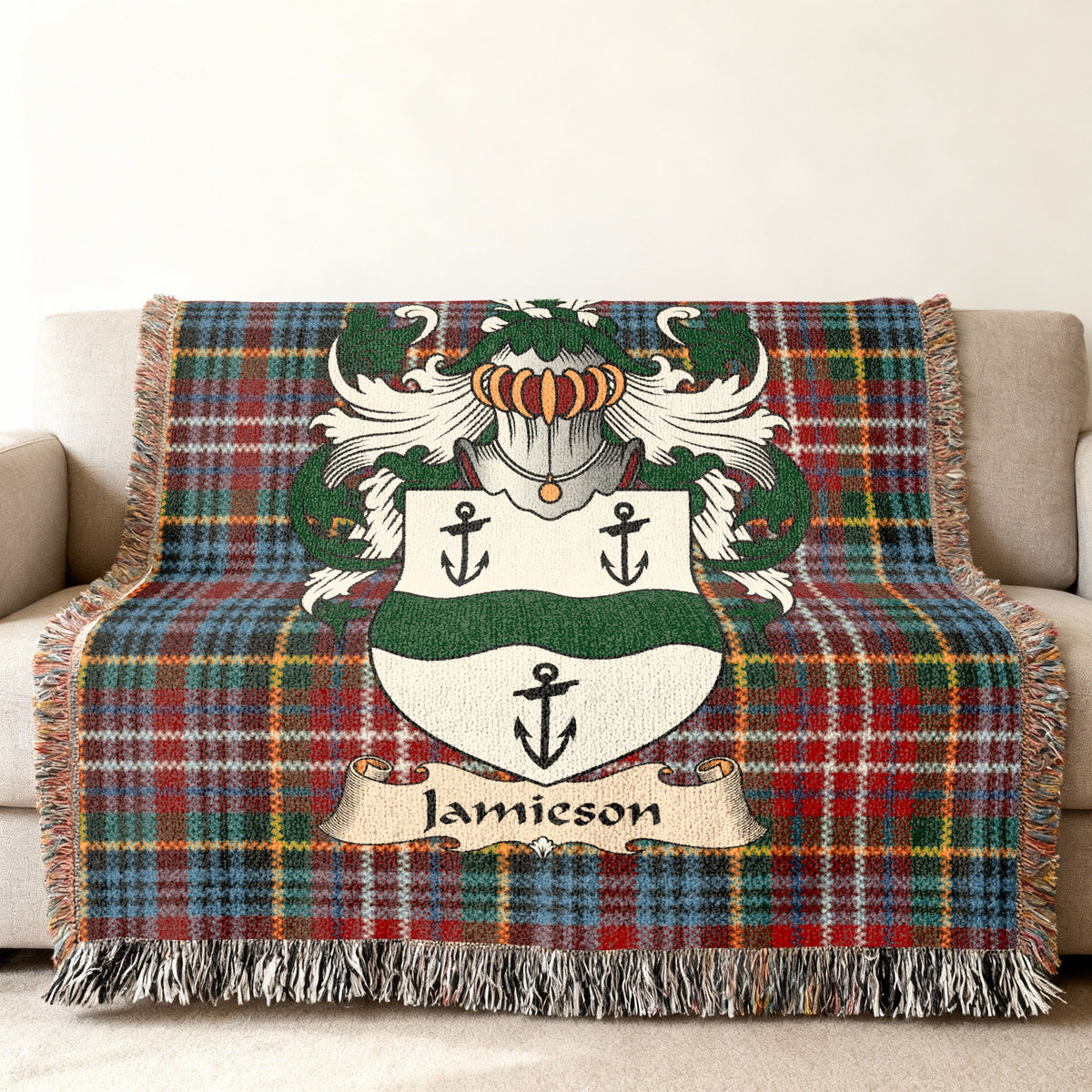 Jamieson family crest emblem on a Caledonia tartan woven blanket