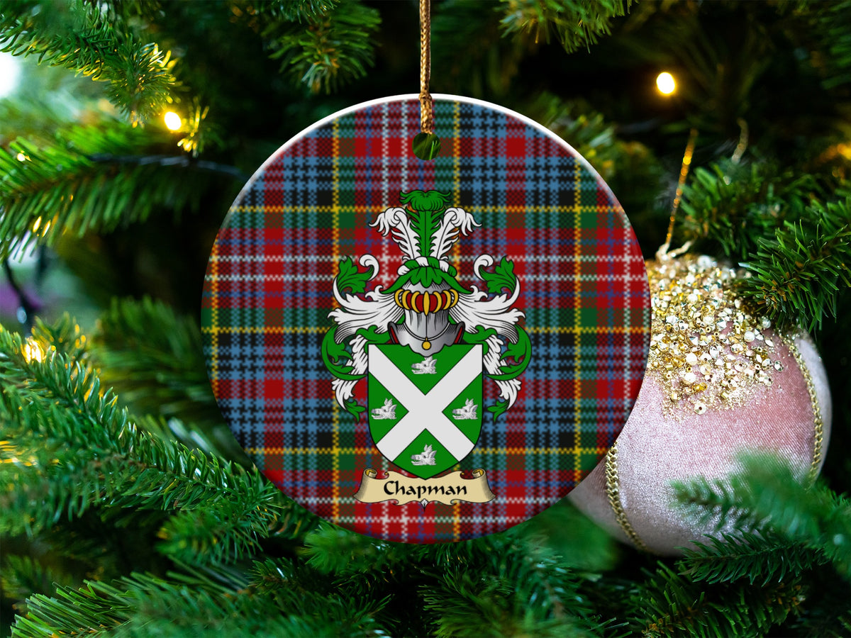 Chapman Scottish clan ceramic ornament with family crest on a Caledonia tartan background, hanging on a Christmas tree