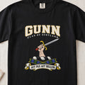 Gunn graphic T-shirt in Black, front flat lay showing varsity lettering and hand and forearm holding a straight silver sword with gold guard and red pommel.