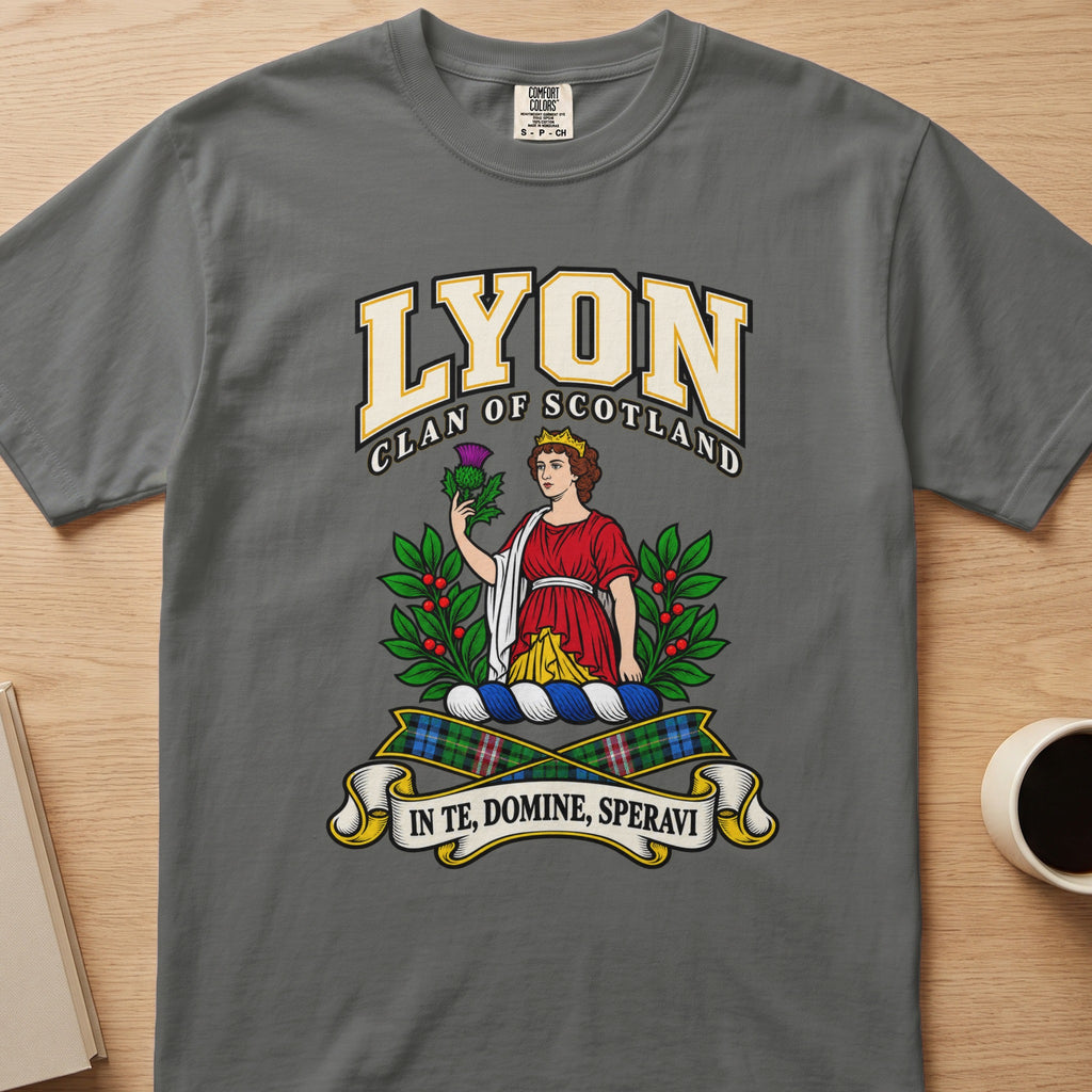 Lyon red-clad figure framed by green branches graphic on a charcoal gray Comfort Colors T-shirt, front view