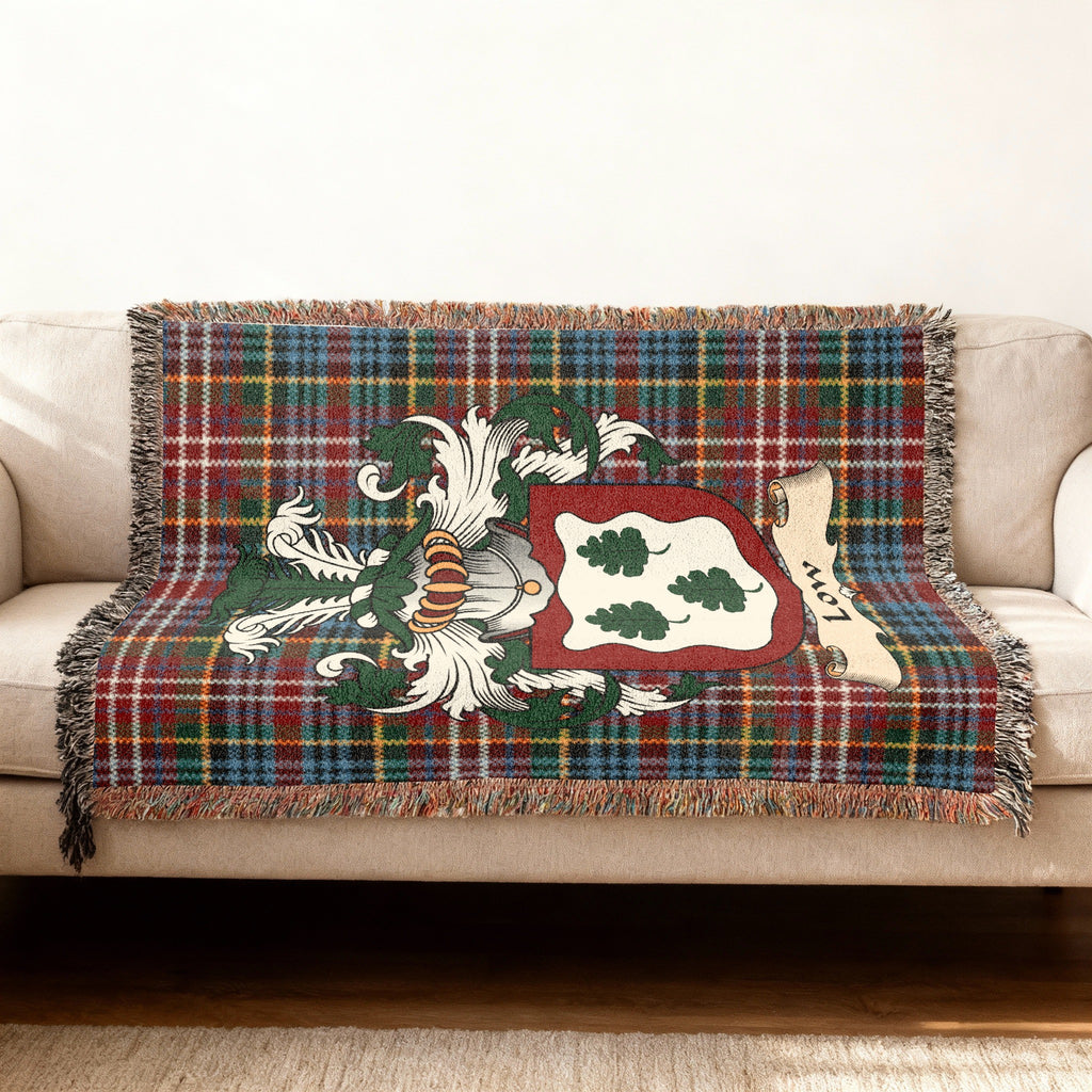 Low Scottish woven blanket with family shield and Caledonia tartan background