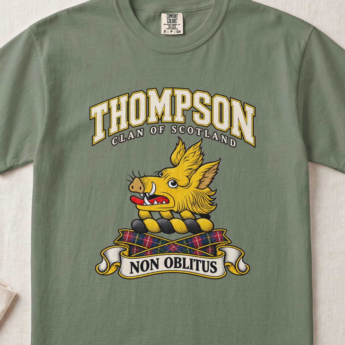Thompson Scottish clan T-shirt in Moss, front view with a golden boar head and motto banner.