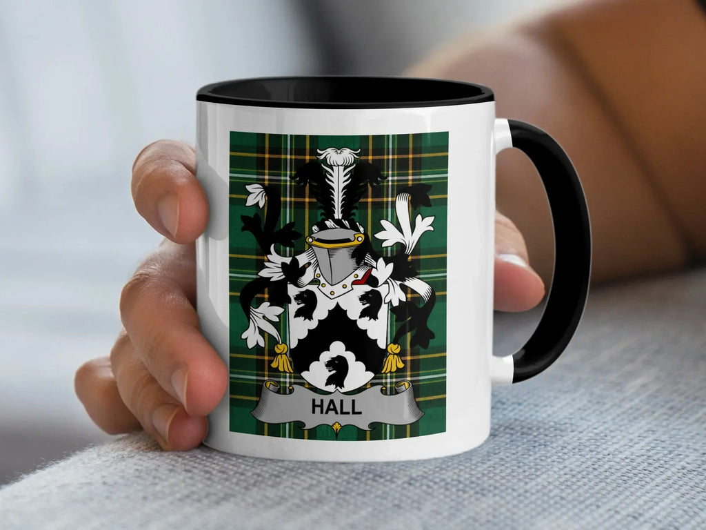 Mug with a Hall family crest on a green plaid background.