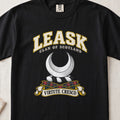 Leask Scottish clan T-shirt in Black, front view with a silver crescent and motto design.