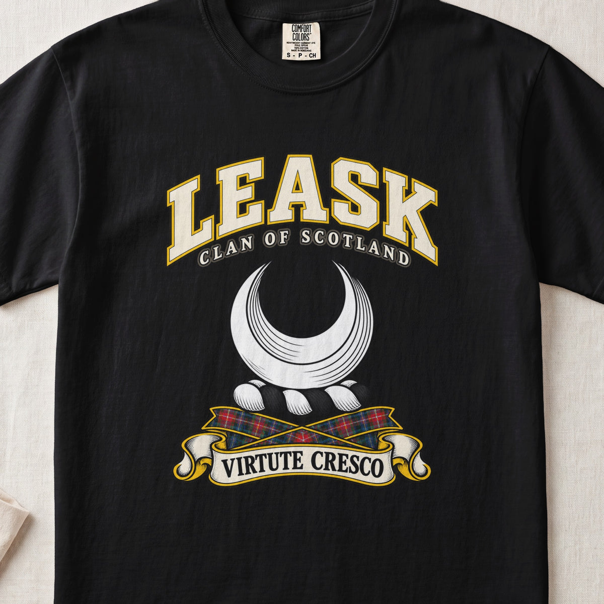 Leask Scottish clan T-shirt in Black, front view with a silver crescent and motto design.