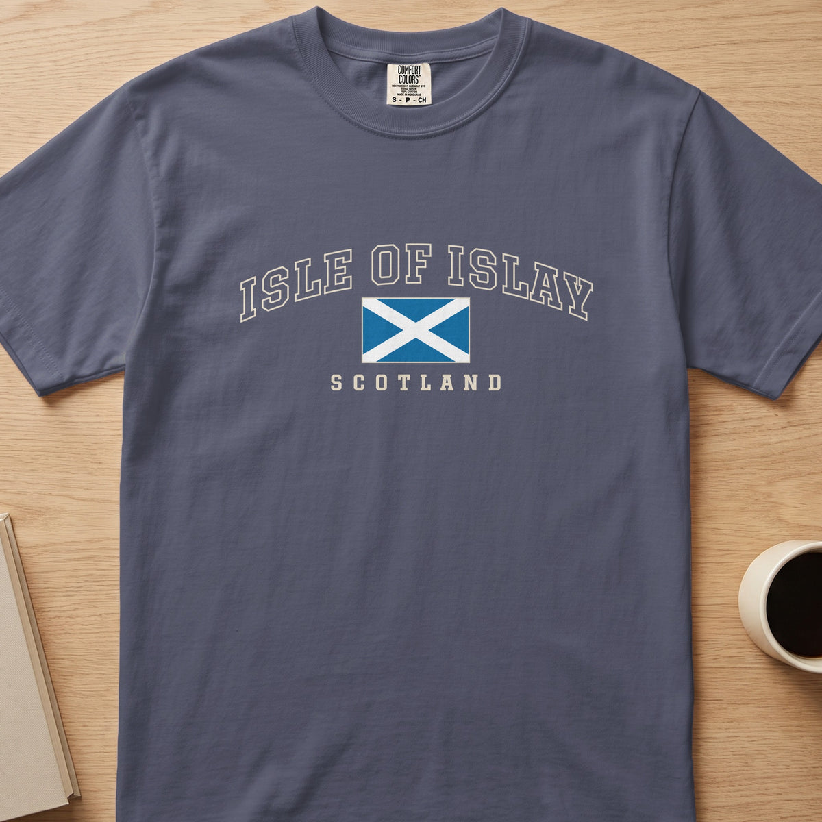 Denim Comfort Colors T-shirt laid flat with Isle of Islay, Scotland lettering and a blue-and-white Saltire