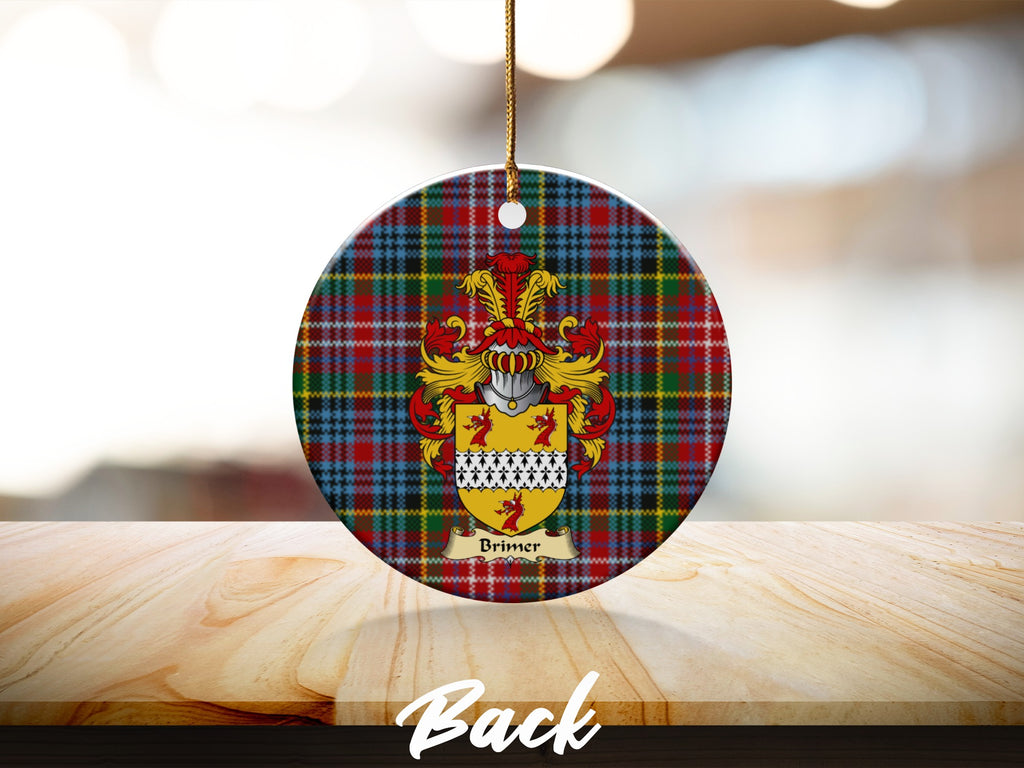 Round Brimer Scottish clan ornament with family crest on a Caledonia tartan background