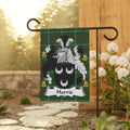 Harris family crest on a green tartan garden flag.