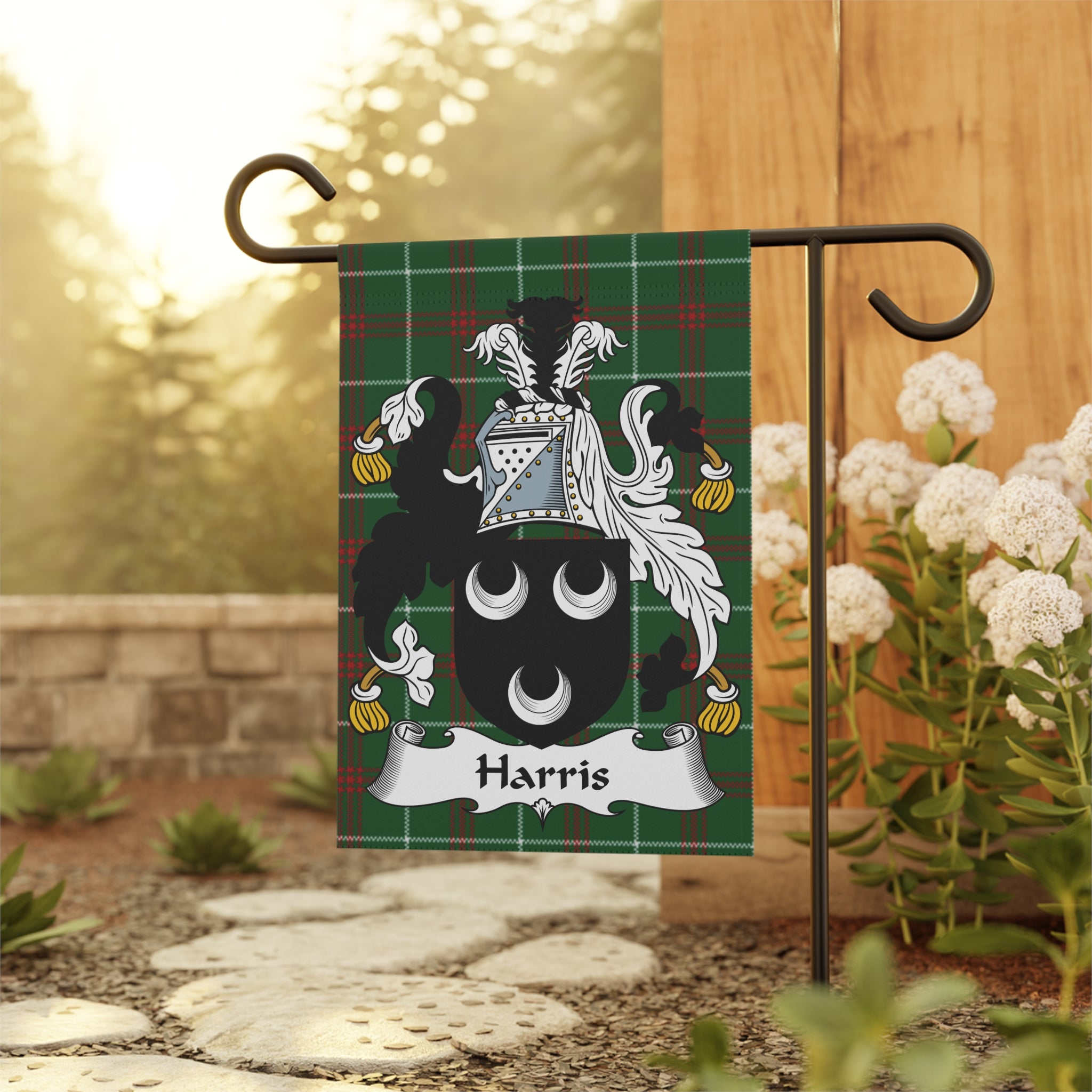 Harris family crest on a green tartan garden flag.