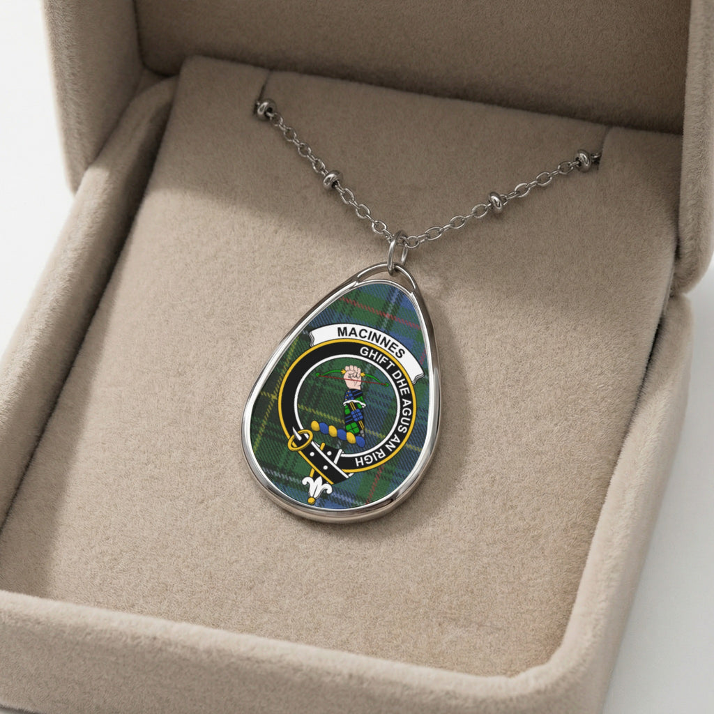 Oval pendant necklace with MacInnes clan crest and motto GHIFT DHE AGUS AN RICH.