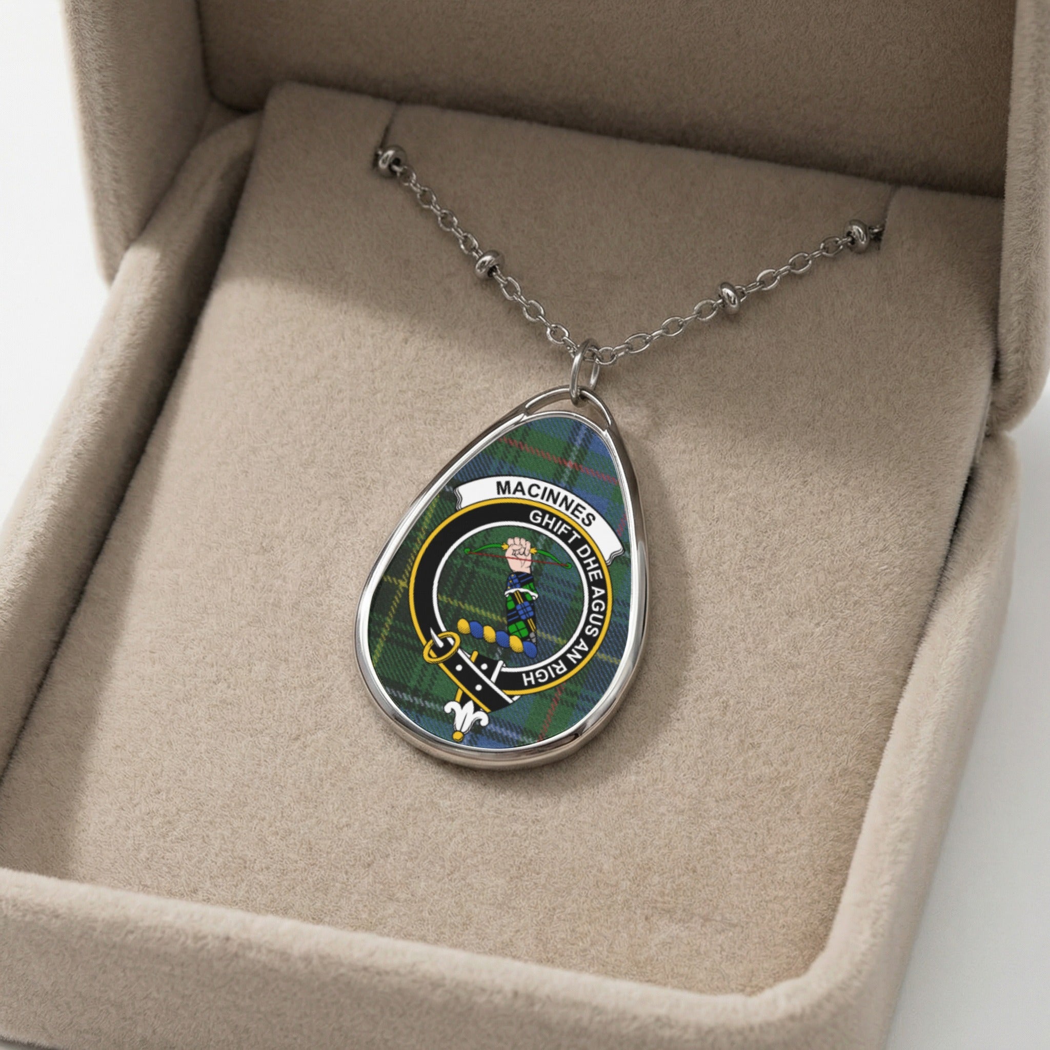 Oval pendant necklace with MacInnes clan crest and motto GHIFT DHE AGUS AN RICH.