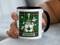 White mug with black rim featuring a green tartan shield and the name "CONCANON".